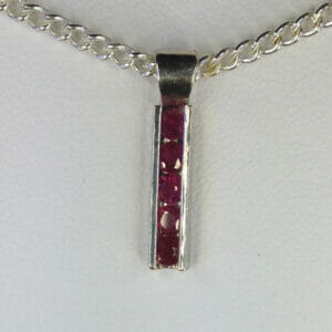 castle-rocks-and-jewelry-rubies-set-in-track-pendant-robert-michael
